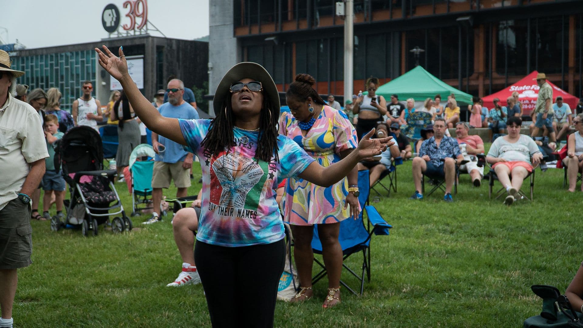 Arms wide on the festival lawn