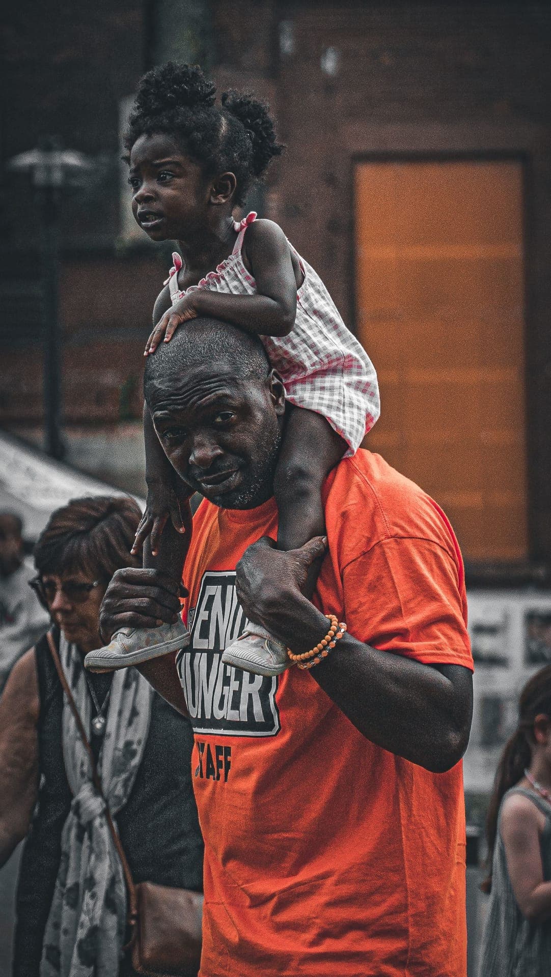 A daughter on her father's shoulders