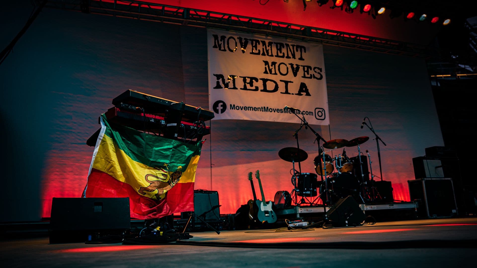 The stage set with the MMM banner and heritage flag