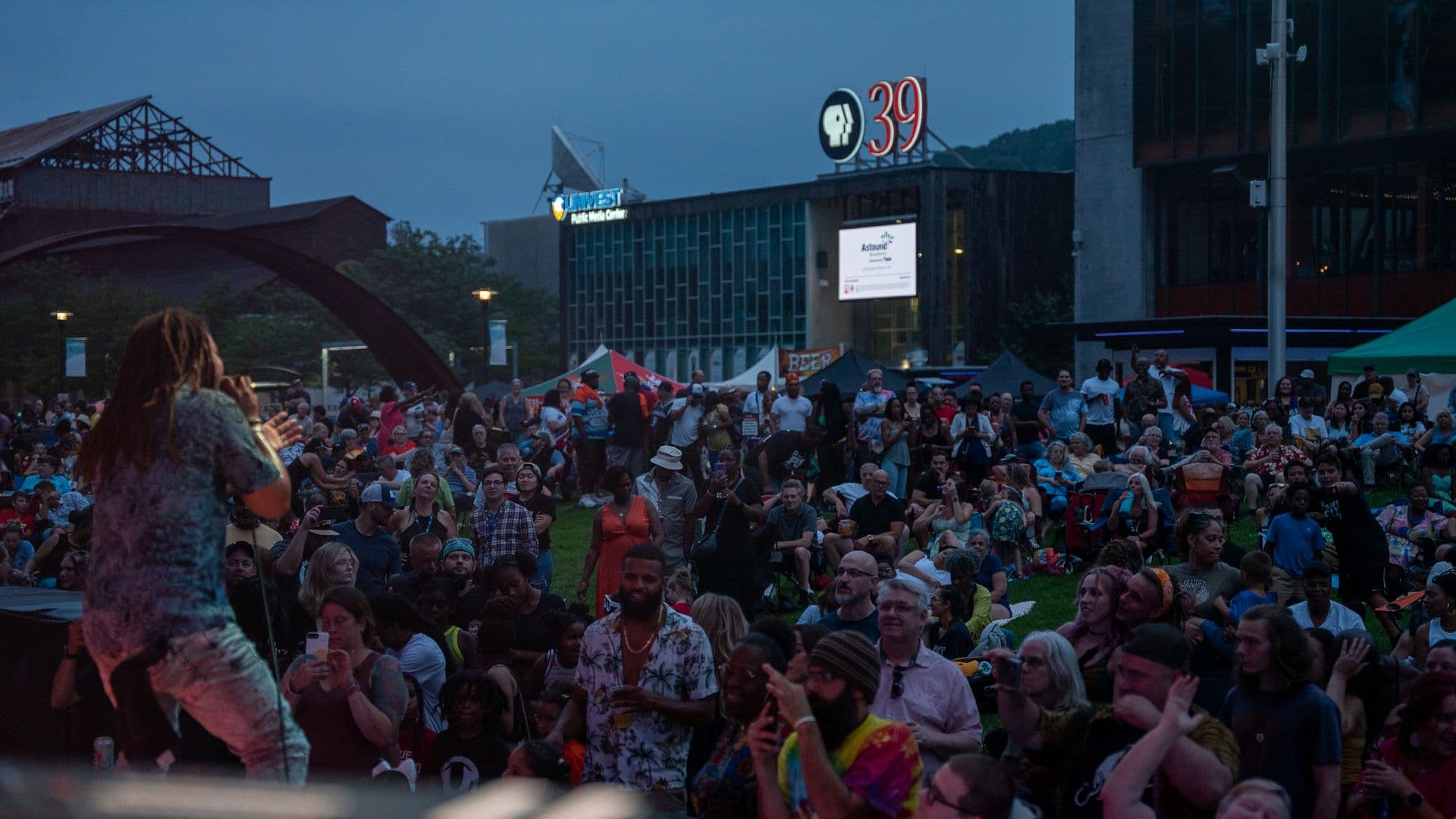 On stage at blue hour, PBS39 sign glowing